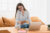 Confident multitasking businesswoman tutor freelancer student talking on phone and working